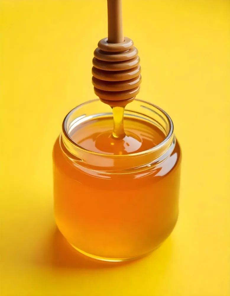A Jar Full Of Honey With A Honey Dipper On A Yellow Background 5 D787