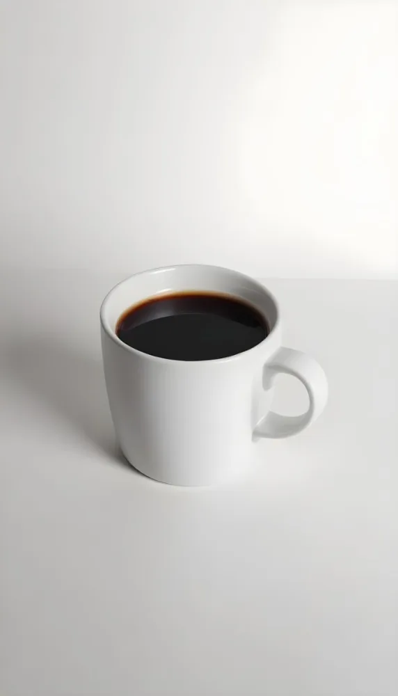 A White Ceramic Mug Filled With Black Coffee Casting A Shadow On A Black Surface Simple And Minimalist Composition Studio Lighting Clean And Modern Aesthetic 25 0ea7