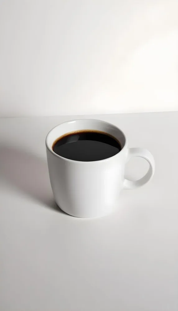 A White Ceramic Mug Filled With Black Coffee Casting A Shadow On A Black Surface Simple And Minimalist Composition Studio Lighting Clean And Modern Aesthetic 7 12f4