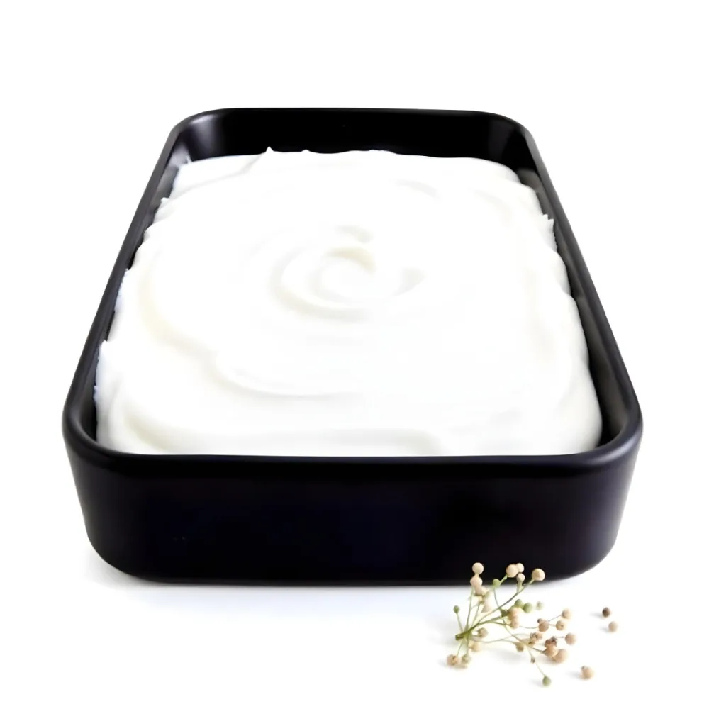 A White Square Plate With Rounded Corners Filled With White Liquid On A White Background 6 Cdf0