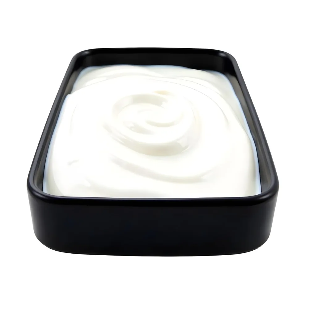 A White Square Plate With Rounded Corners Filled With White Liquid On A White Background 9 683b