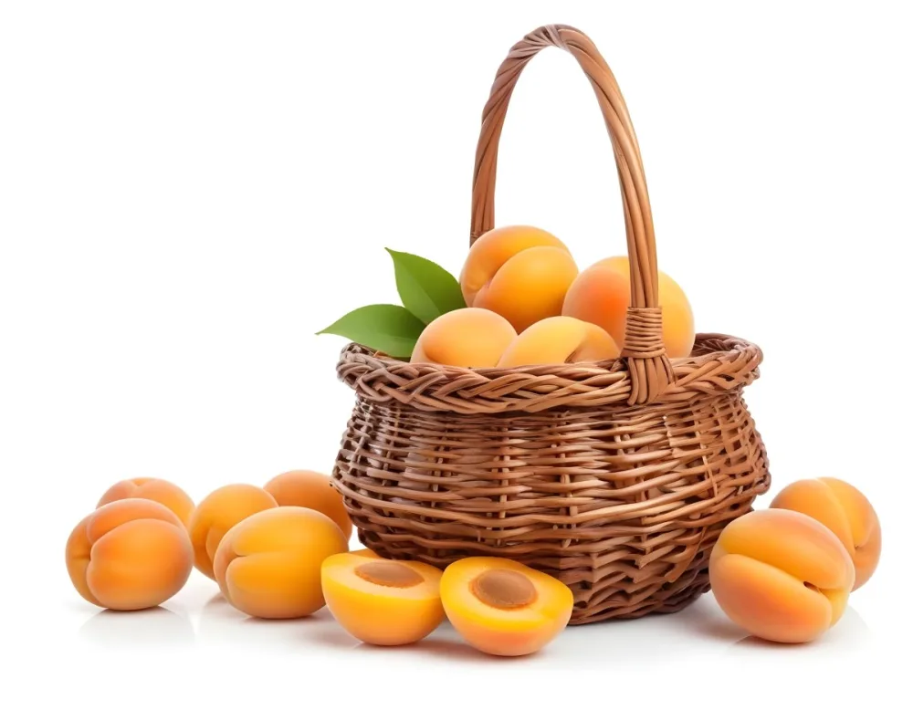 A Wicker Basket Filled With Fresh Ripe Apricots Some Whole And Some Halved With Green Leaves Scattered Around The Basket On A White Background 5 Bf11