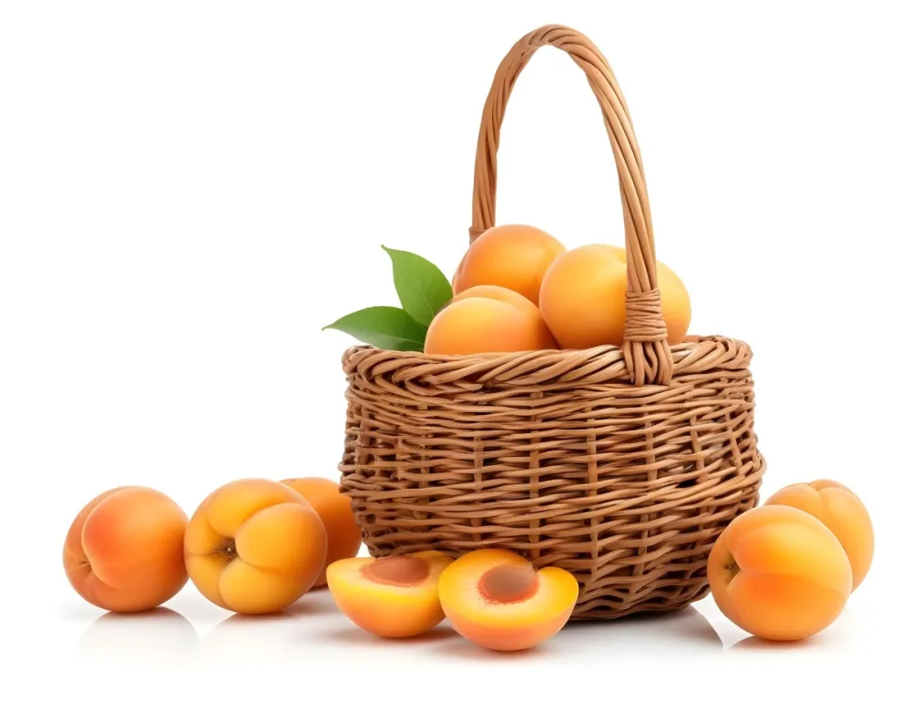 A Wicker Basket Filled With Fresh Ripe Apricots Some Whole And Some Halved With Green Leaves Scattered Around The Basket On A White Background 7 5246