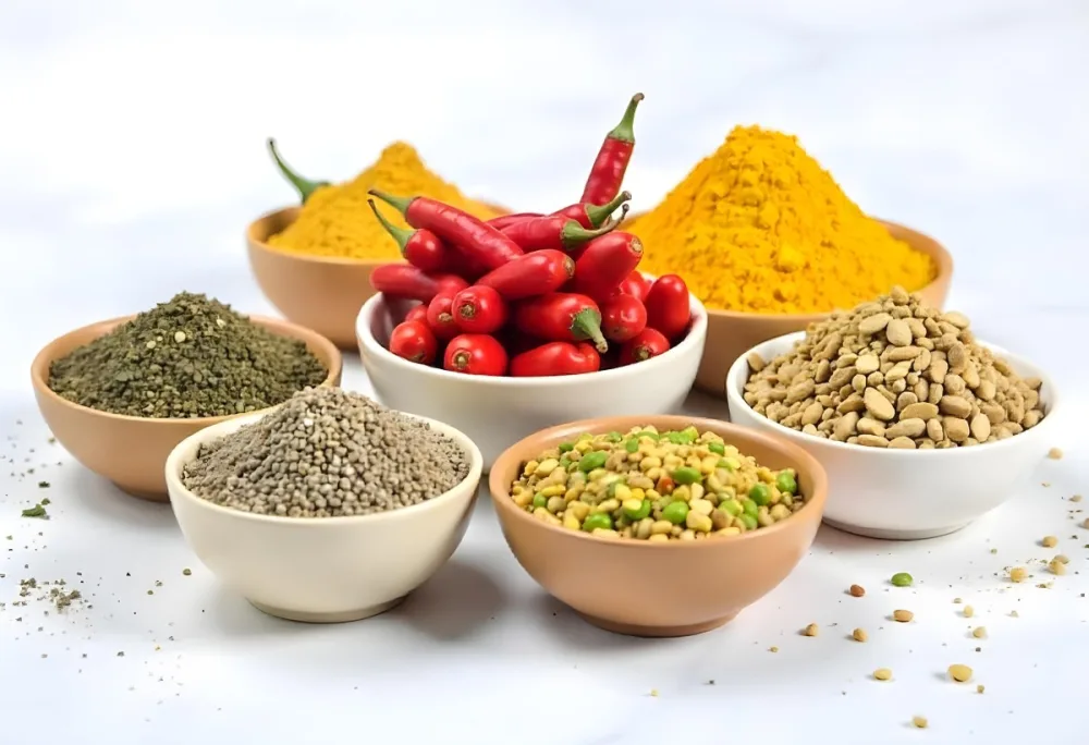 Bowls Of Spices Including Turmeric Chili Peppers Cumin Coriander And Other Ingredients Arranged On A White Surface Creating A Vibrant And Colorful Display Of Culinary Ingredients 16 4664