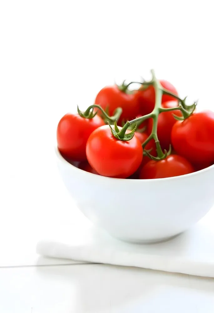 Cherry Tomatoes In A Red Bowl The Tomatoes Are Red And Ripe The Background Is Red And Out Of Focus 17 2d92