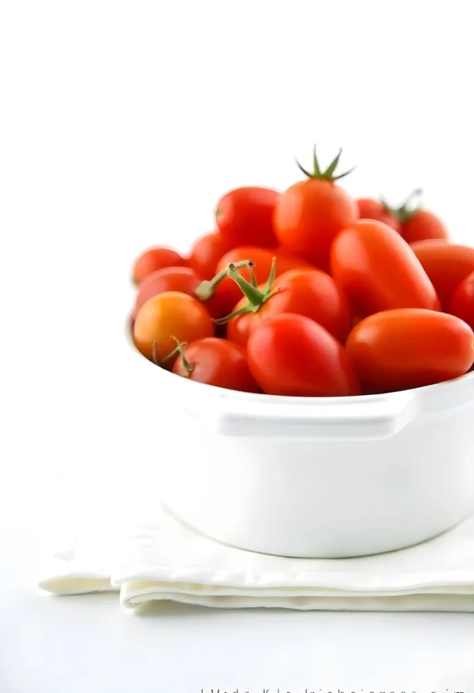 Cherry Tomatoes In A Red Bowl The Tomatoes Are Red And Ripe The Background Is Red And Out Of Focus 29 5652