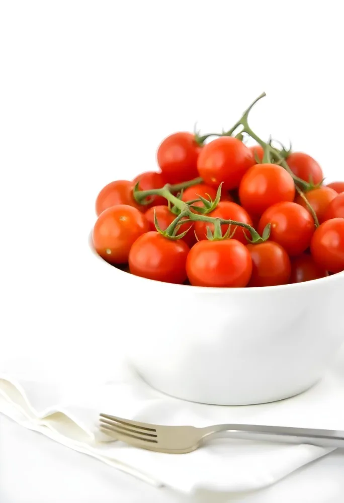 Cherry Tomatoes In A Red Bowl The Tomatoes Are Red And Ripe The Background Is Red And Out Of Focus 6 92e8