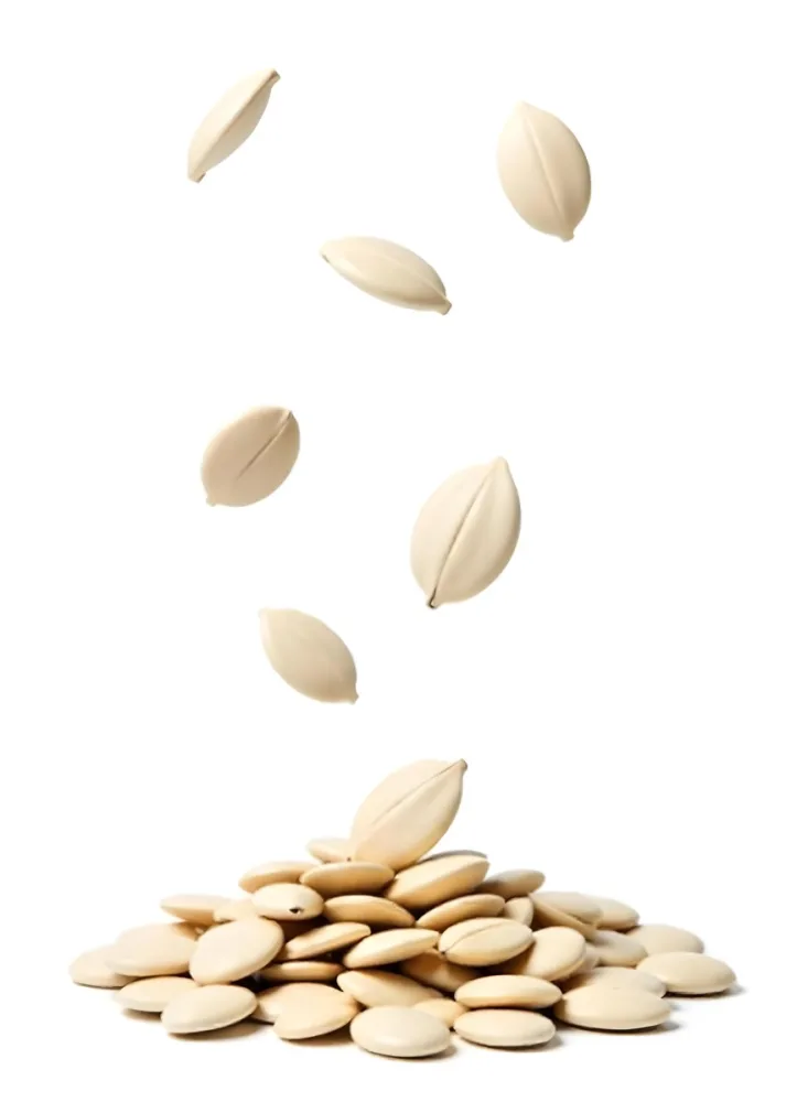 Pumpkin Seeds Falling Into A Pile Of Pumpkin Seeds Isolated On A White Background 5 Ef9a