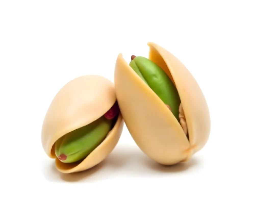 Two Pistachios One Closed And One Open Revealing The Green Nut Inside On A Green Background 19 212b