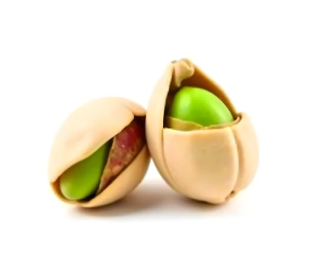 Two Pistachios One Closed And One Open Revealing The Green Nut Inside On A Green Background 3 2345