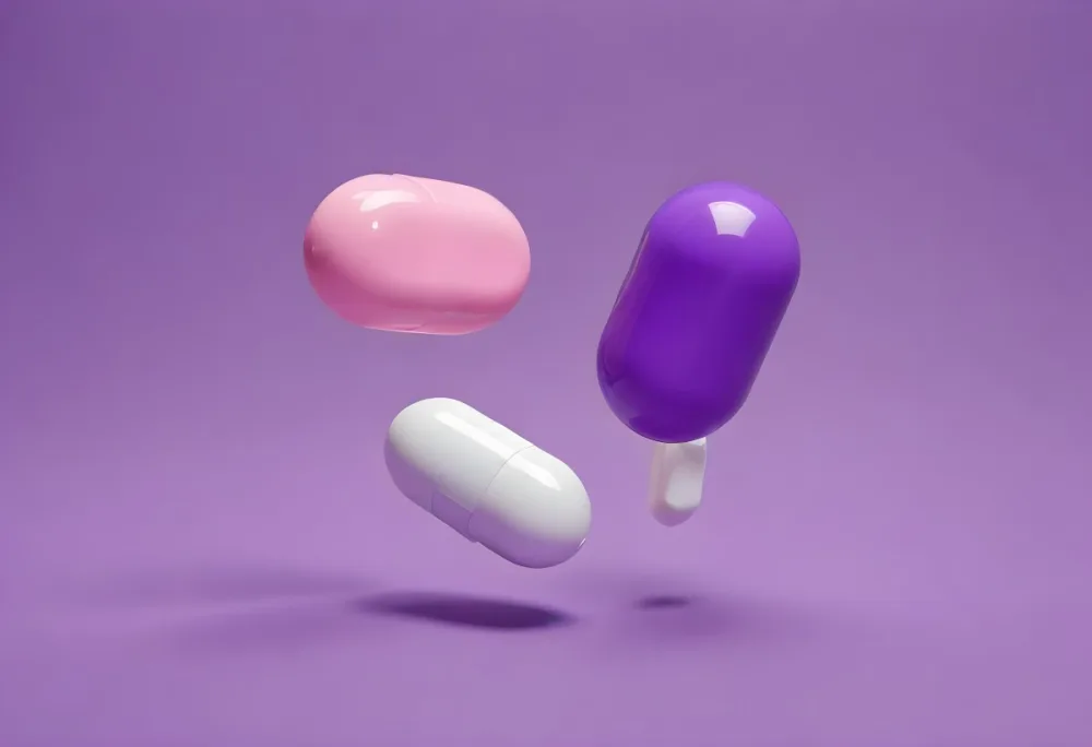 A Pink Pill And A Purple And White Capsule Floating In A Purple Background 7 26e8