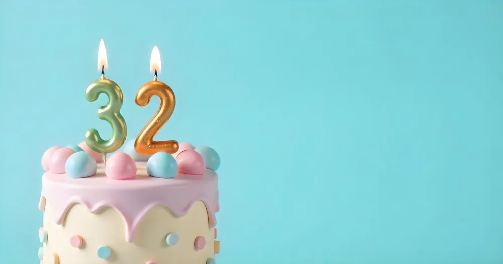 A Birthday Cake With Pastel Colors And A Number 32 Candle On Top In Front Of A Blue Background 24 Cfb8