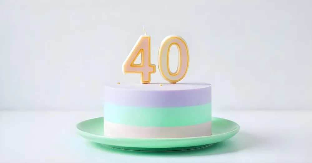 A Birthday Cake With Pastel Colors And Number 40 Candles On A Green Plate Light Purple And Green Frosting Plain White Background 6 C890
