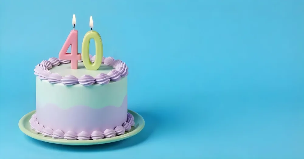 A Birthday Cake With Pastel Colors And Number 40 Candles On A Green Plate Light Purple And Green Frosting Plain White Background 7 C0be