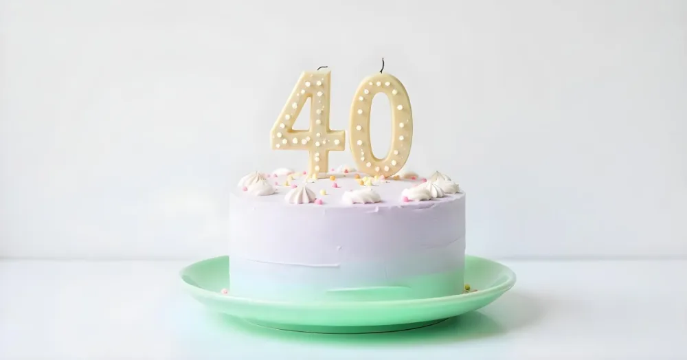 A Birthday Cake With Pastel Colors And Number 40 Candles On A Green Plate Light Purple And Green Frosting Plain White Background 8 75c7