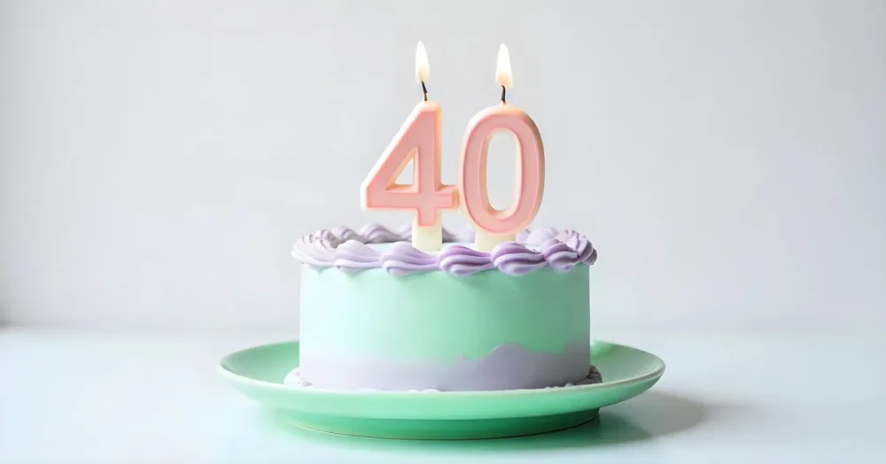 A Birthday Cake With Pastel Colors And Number 40 Candles On A Green Plate Light Purple And Green Frosting Plain White Background 9 C900