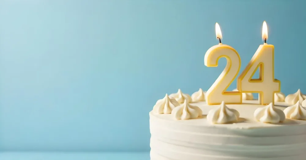 A Birthday Cake With White Frosting And A Candle In The Shape Of The Number 24 Light Blue Background 5 Aea9