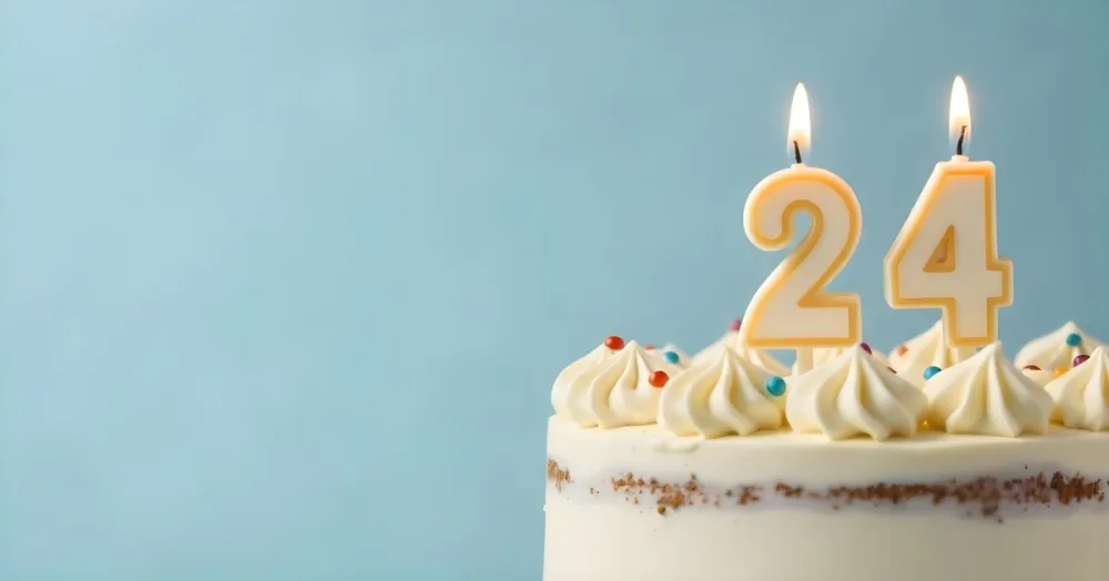 A Birthday Cake With White Frosting And A Candle In The Shape Of The Number 24 Light Blue Background 6 Bbd8