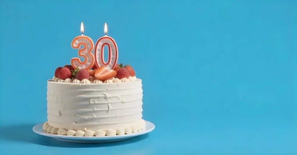 A Cake With Strawberries And Raspberries On Top With A Number 30 Candle On A Blue Background 4 Bee4
