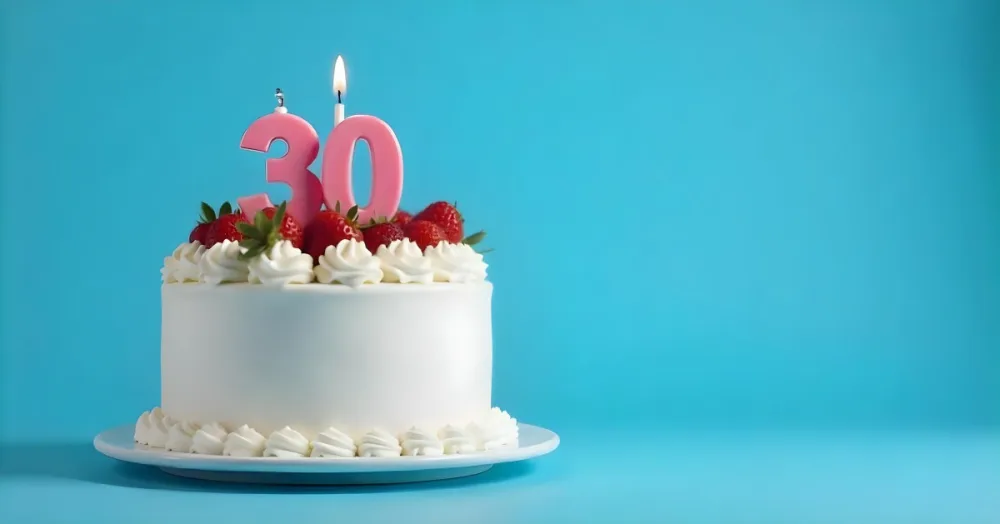 A Cake With Strawberries And Raspberries On Top With A Number 30 Candle On A Blue Background 7 Ae11