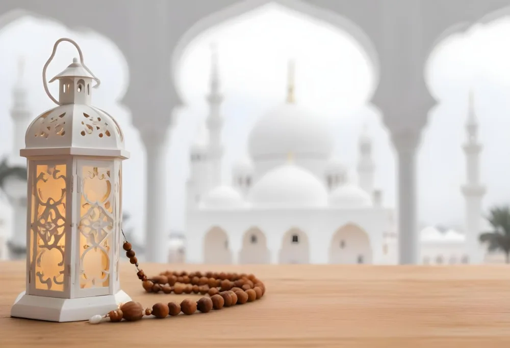 A Lantern And A Tasbih On A Wooden Table In The Background A Mosque With White Arches 15 18ad