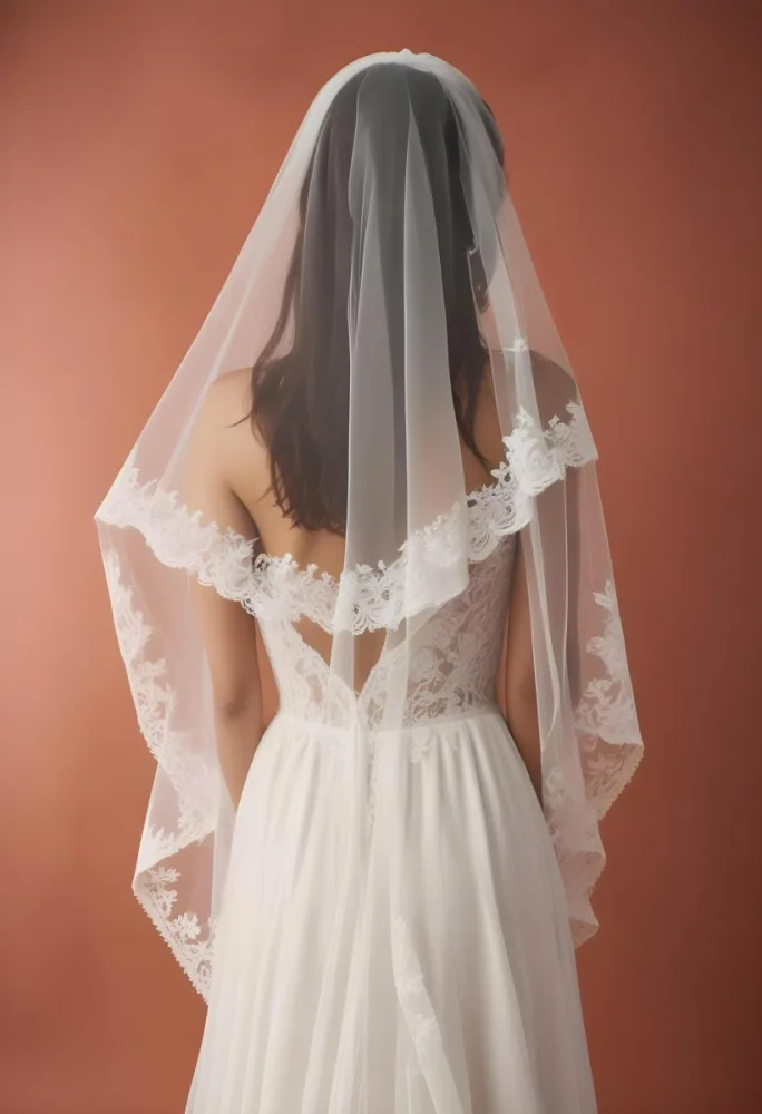 A White Wedding Dress With A Long Flowing Veil Featuring Lace Detailing 3 4af8