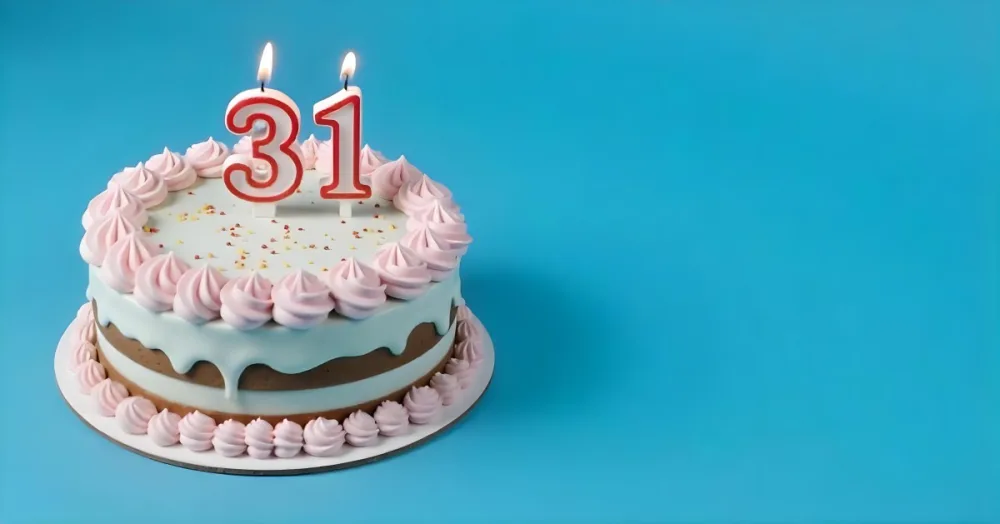 Birthday Cake With Pink Frosting And The Number 31 Candles On Top In A Blue Background 17 0575