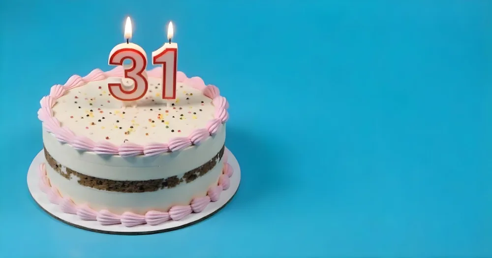 Birthday Cake With Pink Frosting And The Number 31 Candles On Top In A Blue Background 7 3660