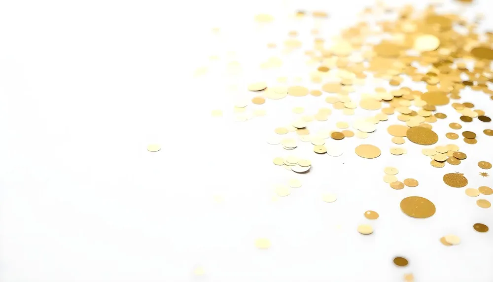 Golden Confetti Scattered On A White Surface Creating A Textured And Shimmering Effect Ideal For Festive Backgrounds Or Celebratory Designs With A Clean And Minimalist Aesthetic 3 8b6a