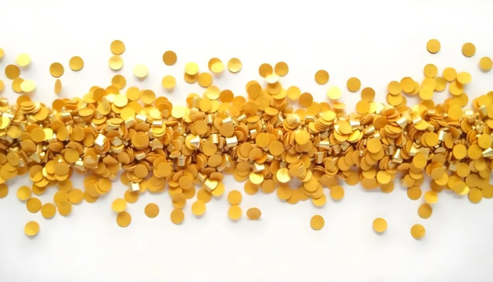 Golden Confetti Scattered On A White Surface Creating A Textured And Shimmering Effect Ideal For Festive Backgrounds Or Celebratory Designs With A Clean And Minimalist Aesthetic 41 Af4b