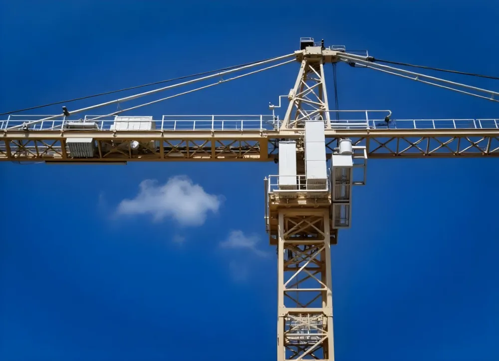 A Large Yellow Construction Crane Against A Bright Blue Sky 1 7c7b
