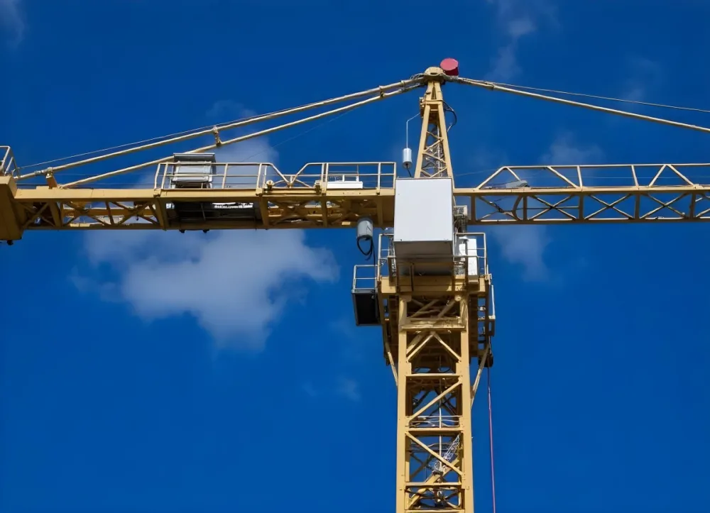 A Large Yellow Construction Crane Against A Bright Blue Sky 10 A06d