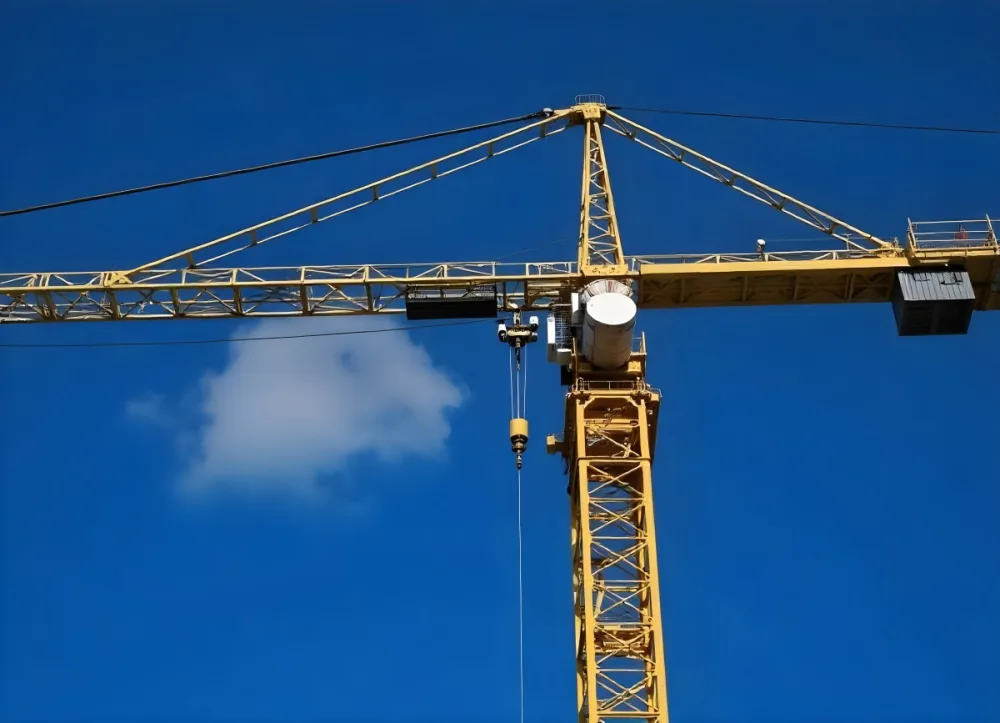 A Large Yellow Construction Crane Against A Bright Blue Sky 8 E8a1