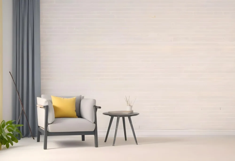 A Gray Armchair With A White Pillow Next To A Small Table With A Book And Some Sticks In A Yellow Room 7 Cc18