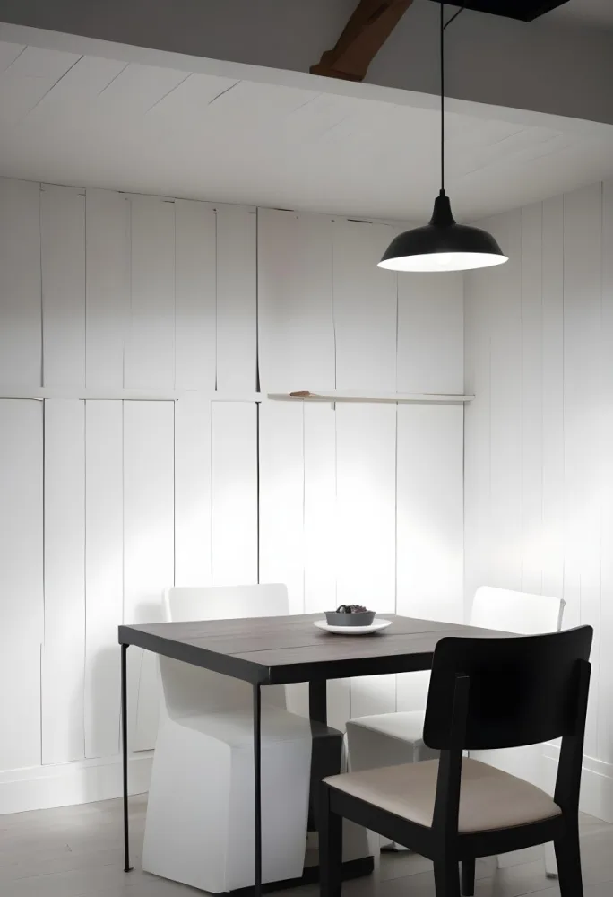 A Minimalist Dining Room With A Wooden Table Chairs And A Pendant Lamp Hanging Above The Table The Walls Are White 14 Bf61