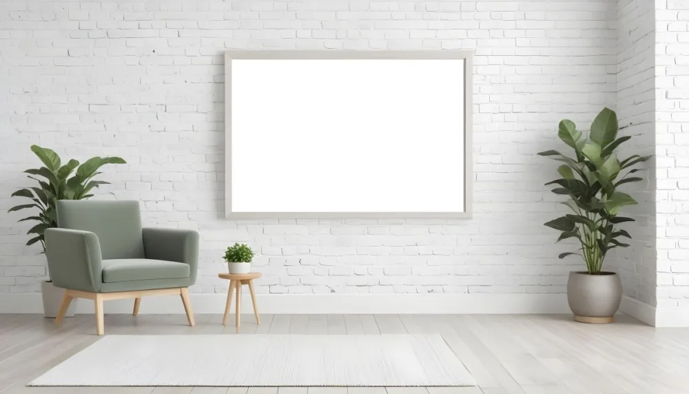A Minimalist Interior Scene Featuring A White Brick Wall A Large Empty White Frame Mounted On The Wall A Light Colored Wooden Floor A Soft White Rug A Small Green Potted Plant Beside The Frame And A Simple Gray Ar 19 4e4f