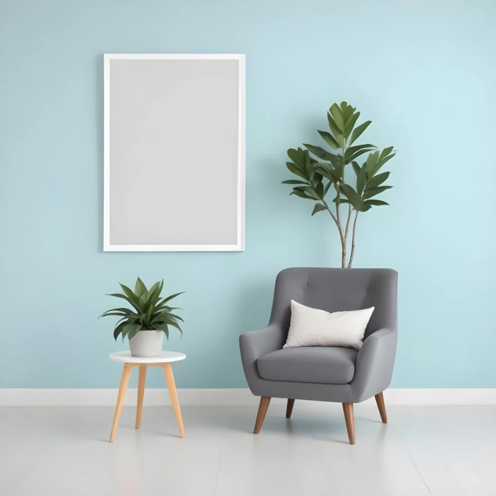 A Modern Living Room With A Gray Armchair A White Framed Wall Art And A Wooden Side Table With A Potted Plant 21 1d03