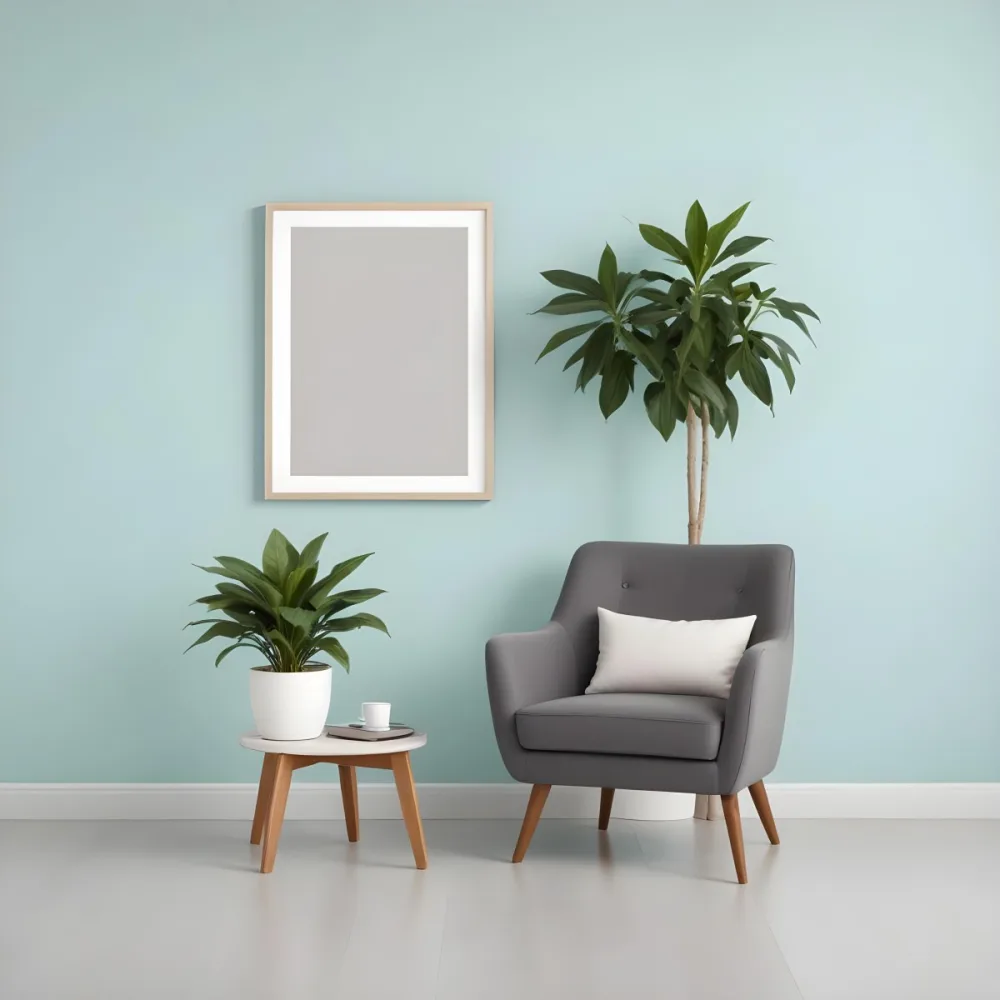 A Modern Living Room With A Gray Armchair A White Framed Wall Art And A Wooden Side Table With A Potted Plant 36 B0f9