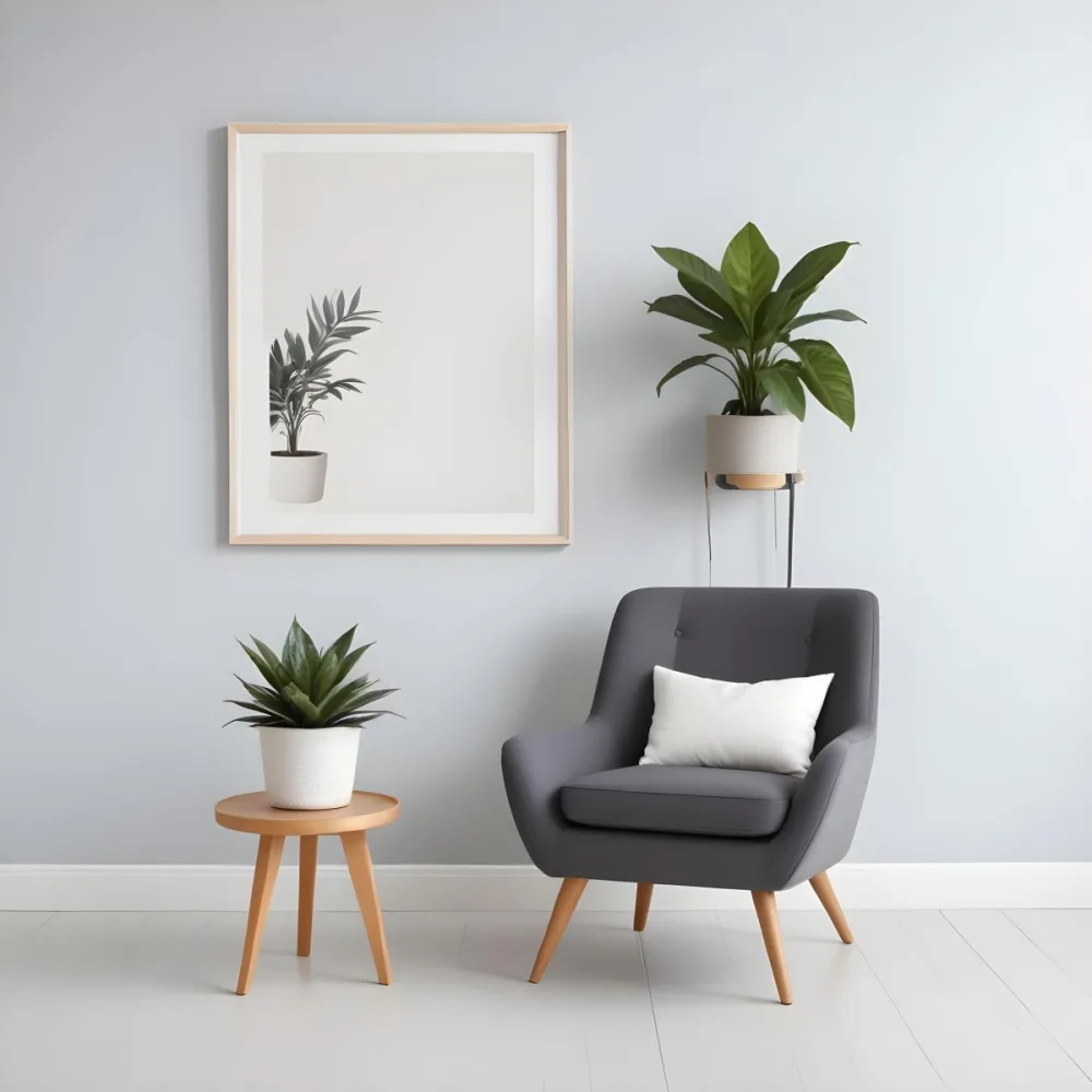 A Modern Living Room With A Gray Armchair A White Framed Wall Art And A Wooden Side Table With A Potted Plant 53 9a5b
