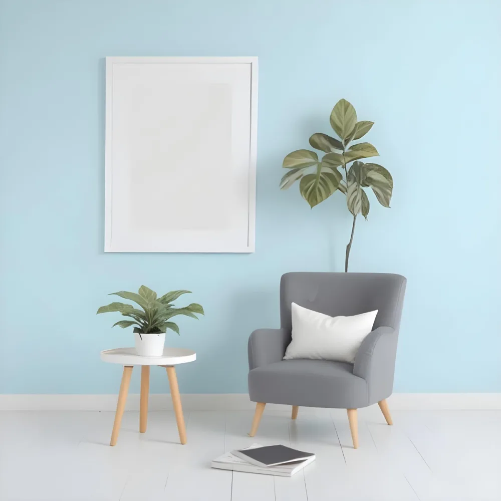 A Modern Living Room With A Gray Armchair A White Framed Wall Art And A Wooden Side Table With A Potted Plant 63 Cd5e