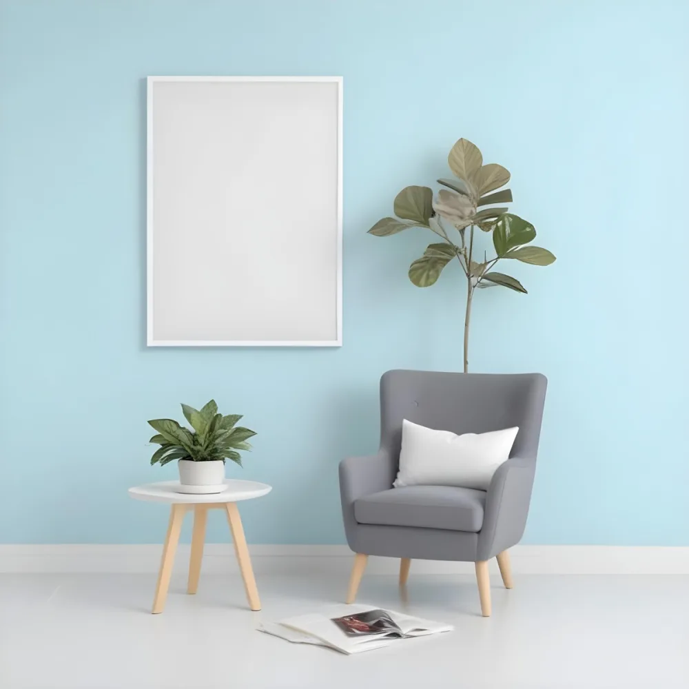 A Modern Living Room With A Gray Armchair A White Framed Wall Art And A Wooden Side Table With A Potted Plant 64 0a74