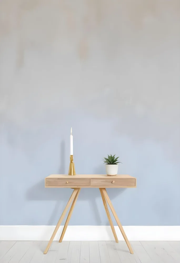 A Wooden Console Table With Two Drawers A White Candle And A Plant In A Golden Pot Against A White Wall 5 A0d3