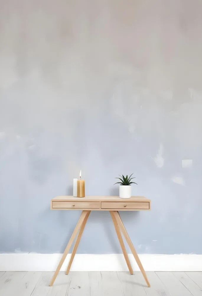 A Wooden Console Table With Two Drawers A White Candle And A Plant In A Golden Pot Against A White Wall 8 4b8f