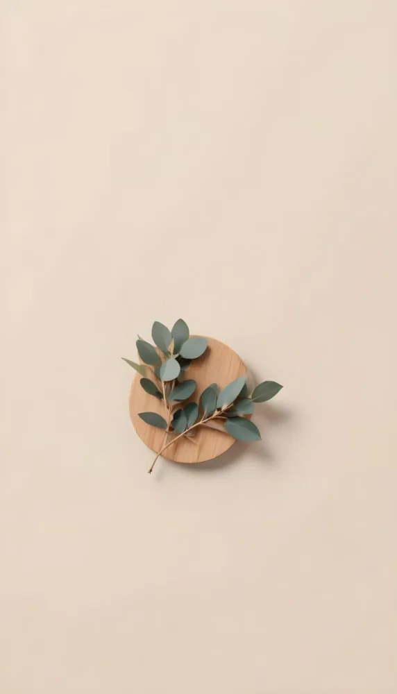 A Eucalyptus Branch On A Wooden Coaster Minimalist Style Light Beige Background Natural Lighting Clean And Simple Composition Natural Elements Neutral Color Palette 11 Cb8c