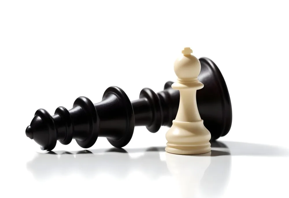 A Fallen Black King Chess Piece Next To A White Pawn On A White Background Dramatic Lighting Studio Shot Victory Concept Strategy Game 1 9914