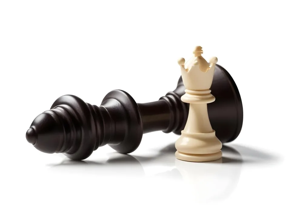 A Fallen Black King Chess Piece Next To A White Pawn On A White Background Dramatic Lighting Studio Shot Victory Concept Strategy Game 5 E1c9