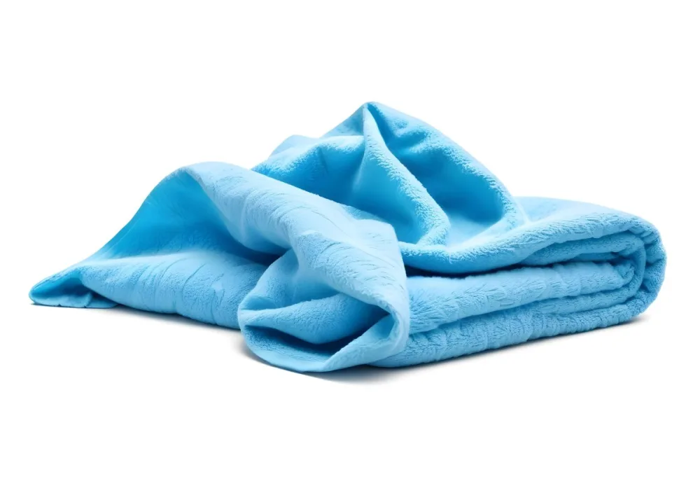 A Light Blue Towel Terrycloth Texture Folded And Crumpled Soft And Absorbent For Drying Or Cleaning On A White Background 1 52ca