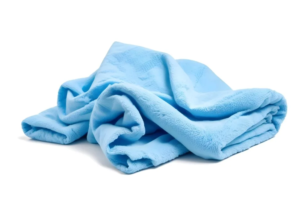 A Light Blue Towel Terrycloth Texture Folded And Crumpled Soft And Absorbent For Drying Or Cleaning On A White Background 4 6bb9