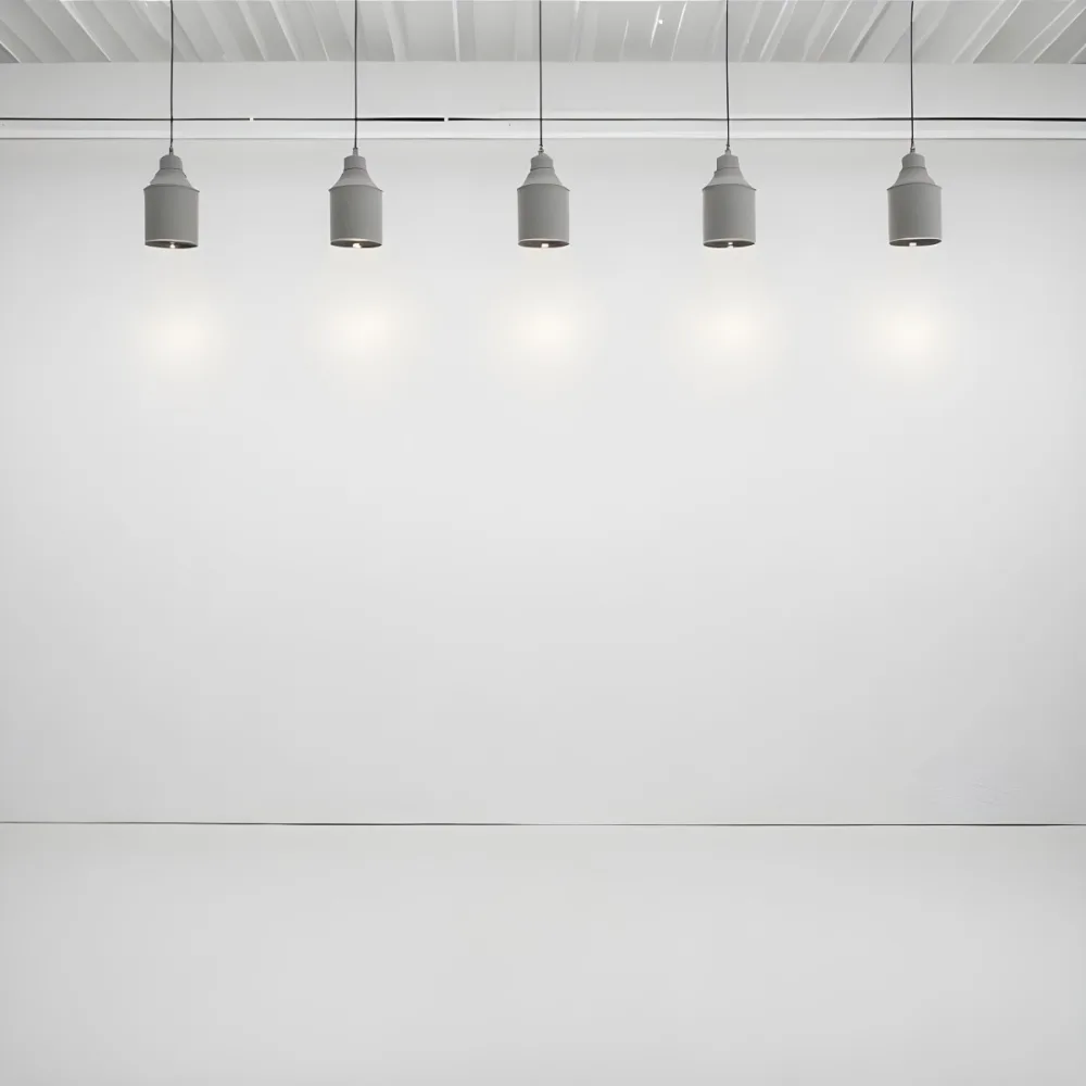 A Minimalist White Room With A High Ceiling And Hanging Pendant Lights 23 Ada2