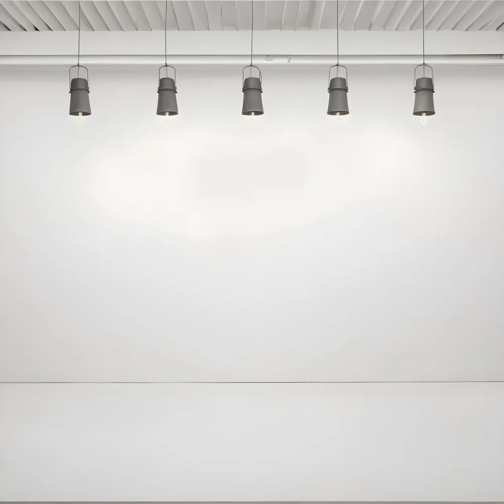 A Minimalist White Room With A High Ceiling And Hanging Pendant Lights 56 C74f